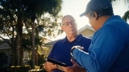 Breezeline Technician talking to HOA manager