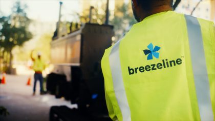 Breezeline technician in yellow vest