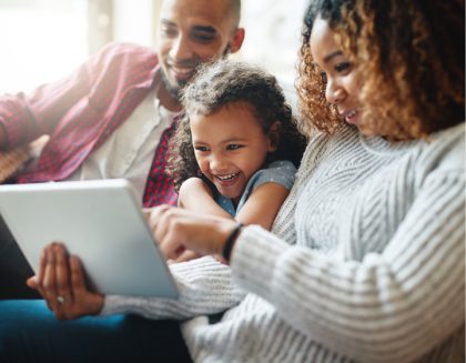 Family watching TV on tablet.