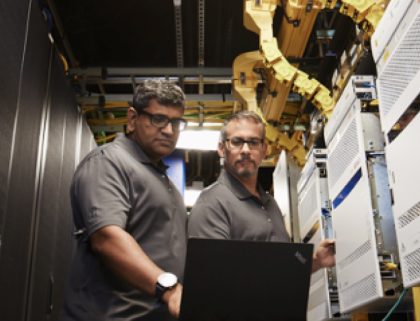 Men working in server room