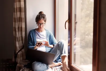 Woman looking down at mobile phone