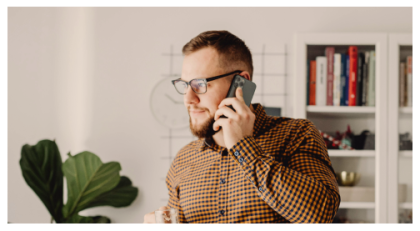 Young man holding mobile phone up to ear