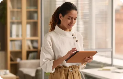 Woman checking her Breezeline Affiliate Program commissions on a tablet