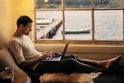 Man sitting looking at a laptop