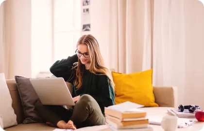 A girl typing on her laptop.