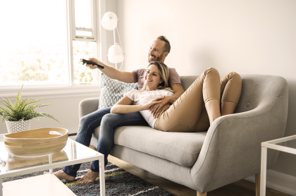 Woman looking at laptop while sitting on the ground